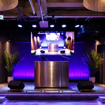 Dining room equipped with a stunning 100-inch TV monitor and fixed-point cameras.