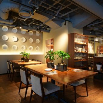 Our dining area offers relaxed seating at tables.There are two tables for two, perfect for enjoying a fun time with friends or family.The warm wooden tables and lush potted plants create a comfortable space where you can enjoy a relaxing meal.Have a special time!