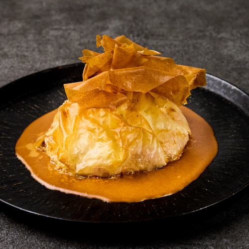 Part filo wrapped with plenty of seafood (shrimp, crab, scallops, etc.)