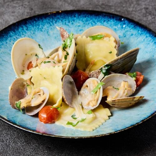 White clams and clams marinière with cheese ravioli