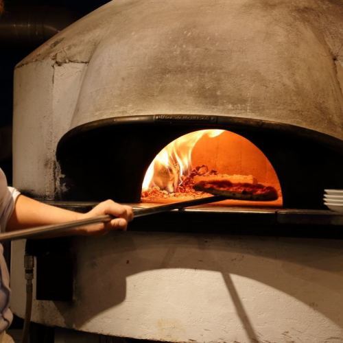 Pizza baked in a wood-fired kiln