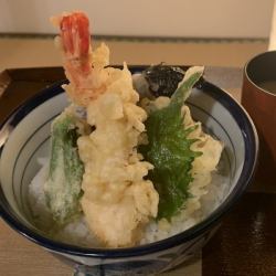 Bowl of rice and fried fish