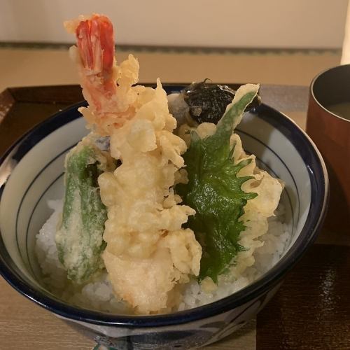 Bowl of rice and fried fish
