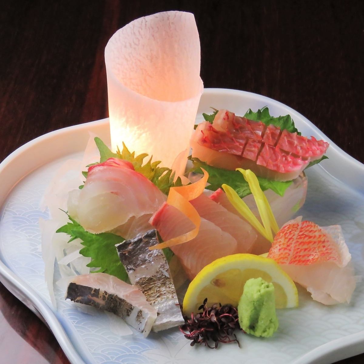 Assorted sashimi of fresh local fish caught that day carefully cut by skilled craftsmen